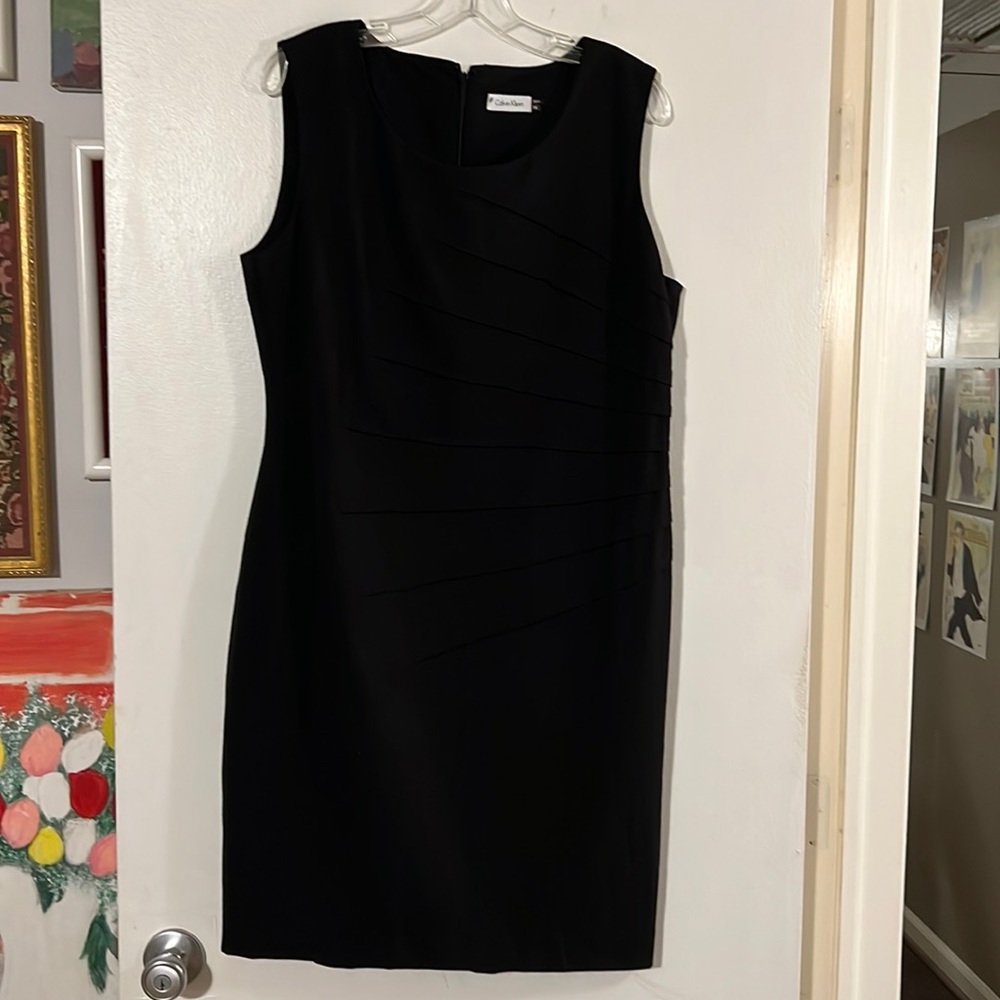 Calvin Klein little black dress sheath. Sleeveless with hidden back zip